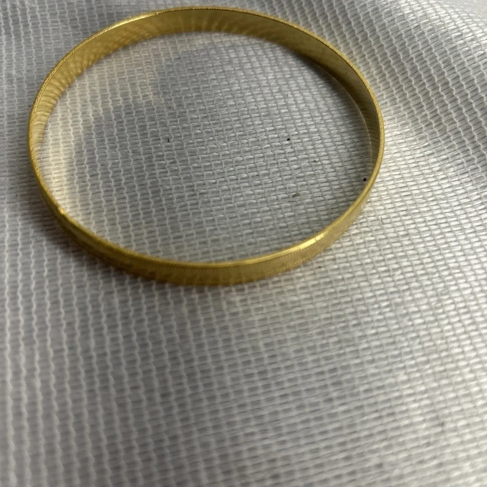 Gold Tone Heart Engraved Bangle Bracelet Measuring 2 3/4 Inches Across